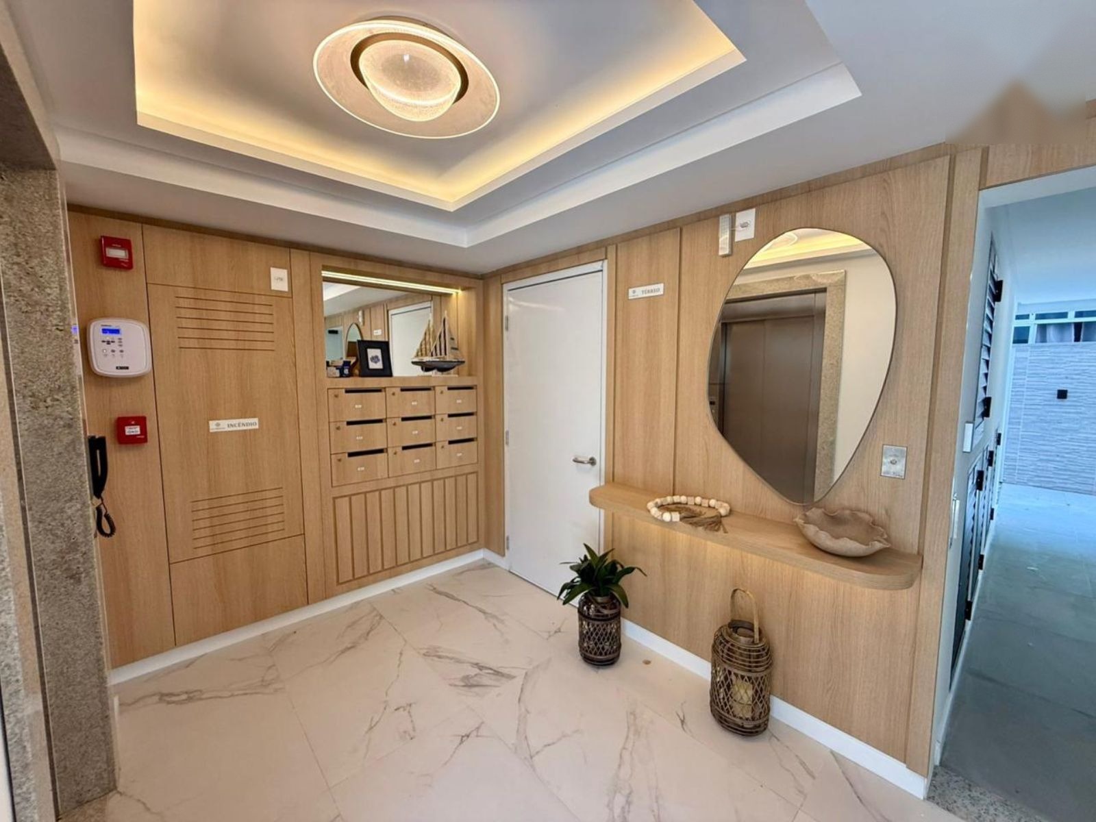 Decorated entrance hall with elevator and mailboxes