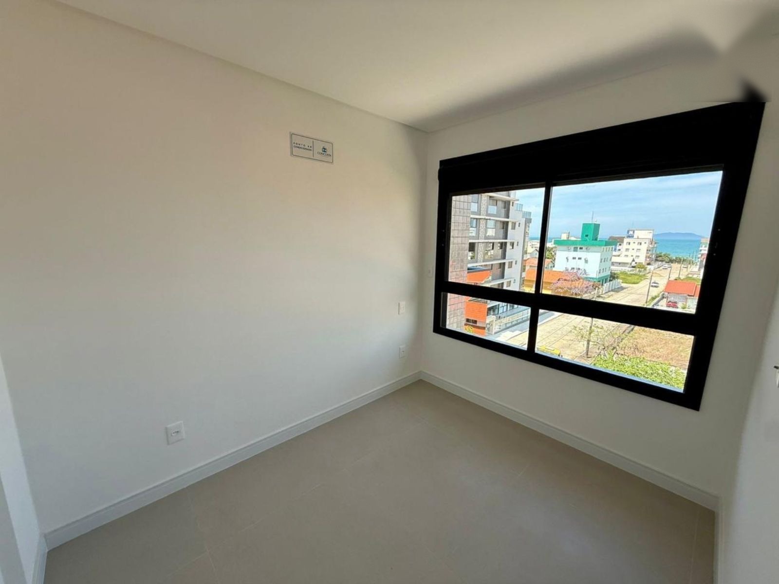 Bedroom with a wide window and view