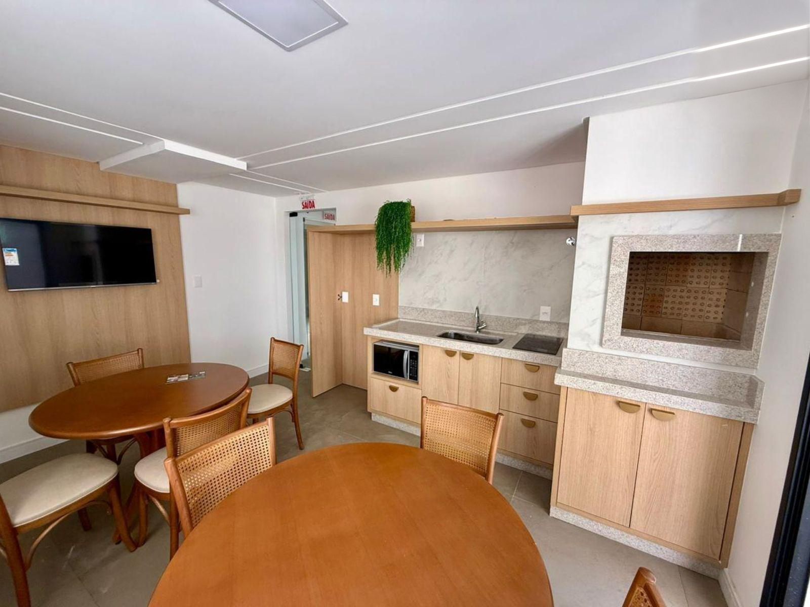 Party room with barbecue, TV and tables